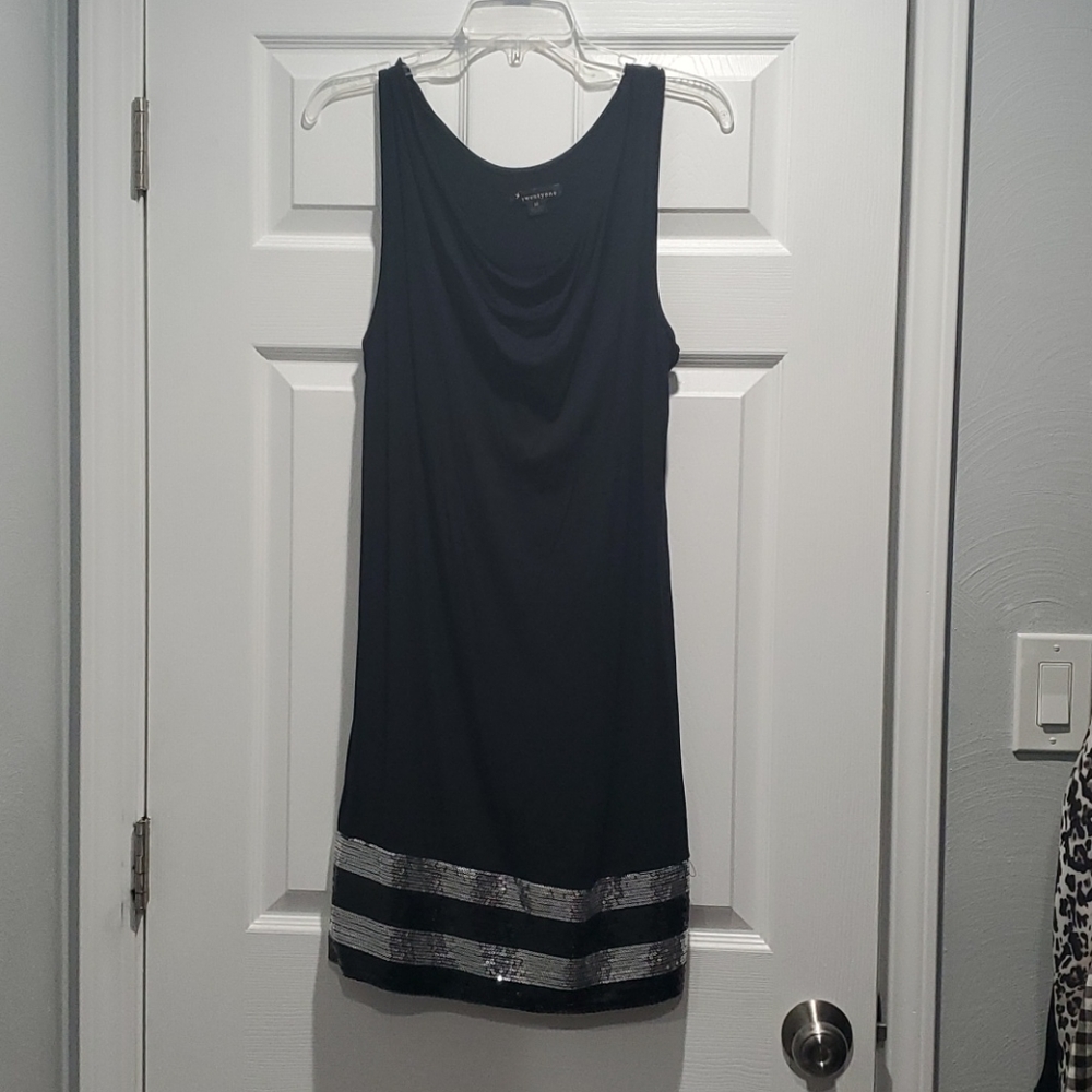 Black dress with sequin detail at bottom.